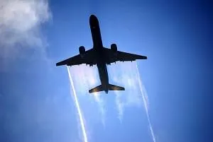 Airplane soaring through clouds